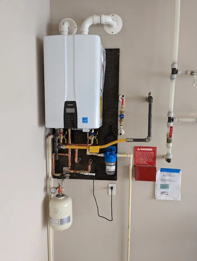 Professional plumber installing copper piping in a Palos Heights home